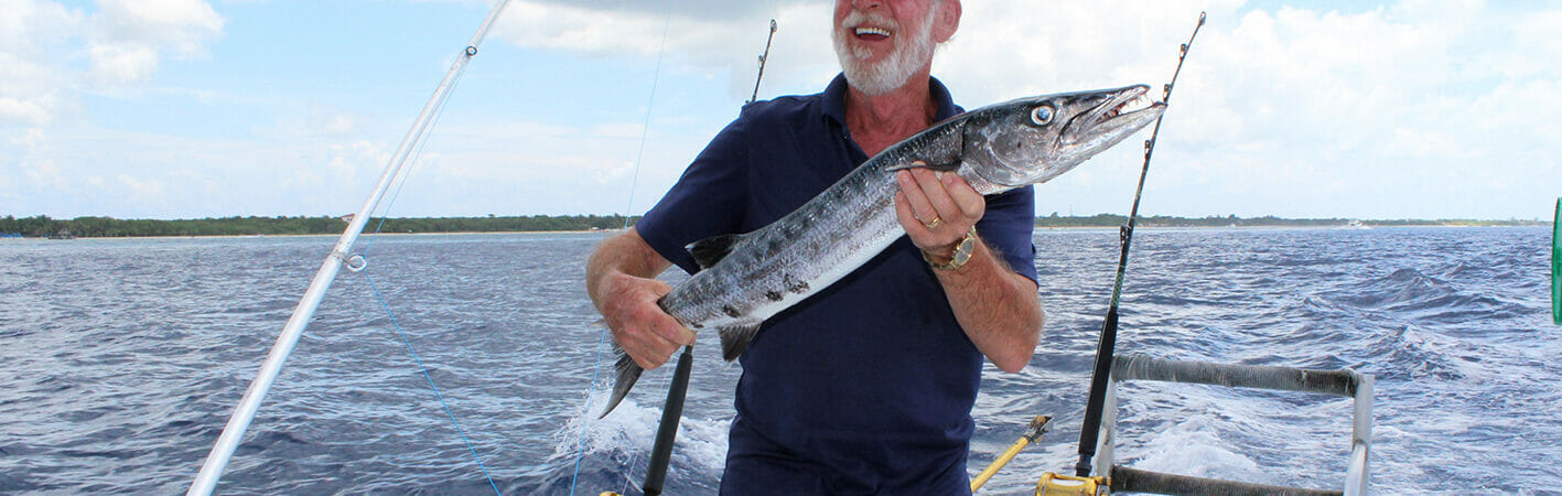 man deep sea fishing in Cozumel